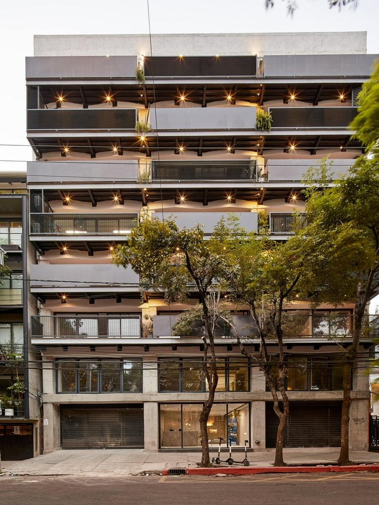 Exterior of the modern multi-story office building at Calle Colima 161, Colonia Roma Norte.