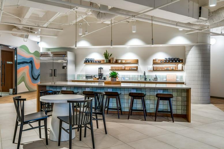 Spacious communal kitchen and dining area at East Las Colinas Boulevard Suite 300.
