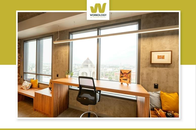 Spacious communal lounge at Ignacio Ramírez, Tabacalera, Mexico City with a wooden counter and city views.