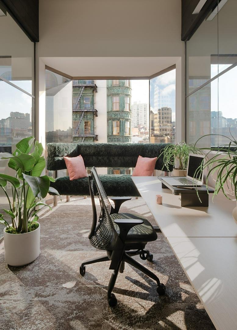Private office suite at Jackson Square, 595 Pacific Avenue, Floor 4 with a city view and plush seating.