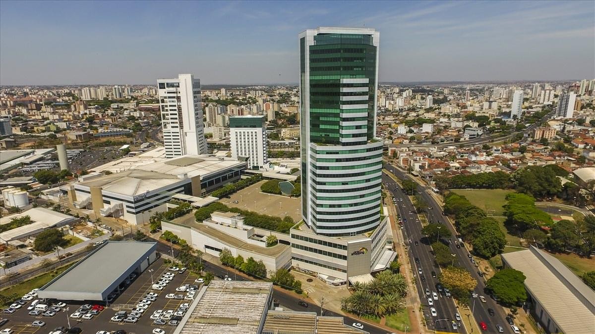 Aerial view of the modern glass Center Office Corporate Building on João Naves de Ávila Avenue.