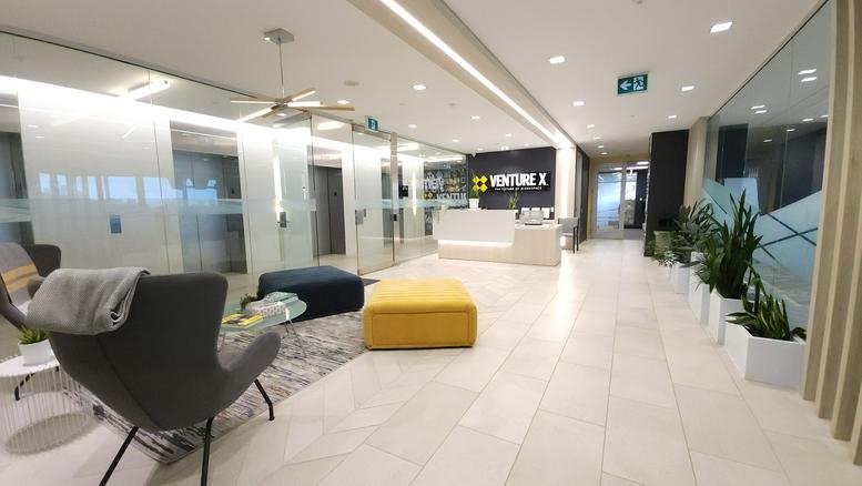 Spacious reception lobby at 1290 Central Parkway West 11th Floor Suite 1100 with modern seating and plants.