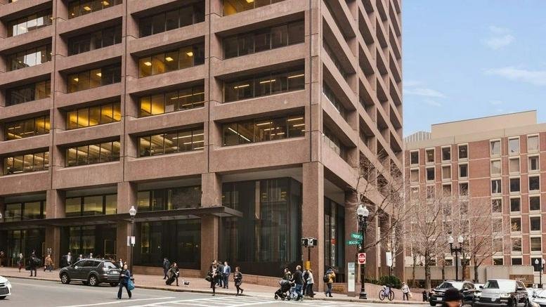 Exterior view of the red brick high-rise facade at 1 Beacon Street.