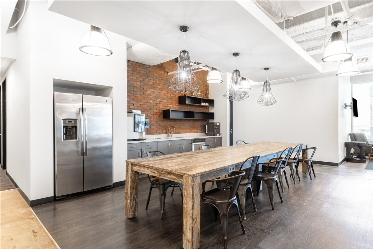 Spacious communal kitchen and dining area at The Leverett Saltonstall Building, 100 Cambridge Street.