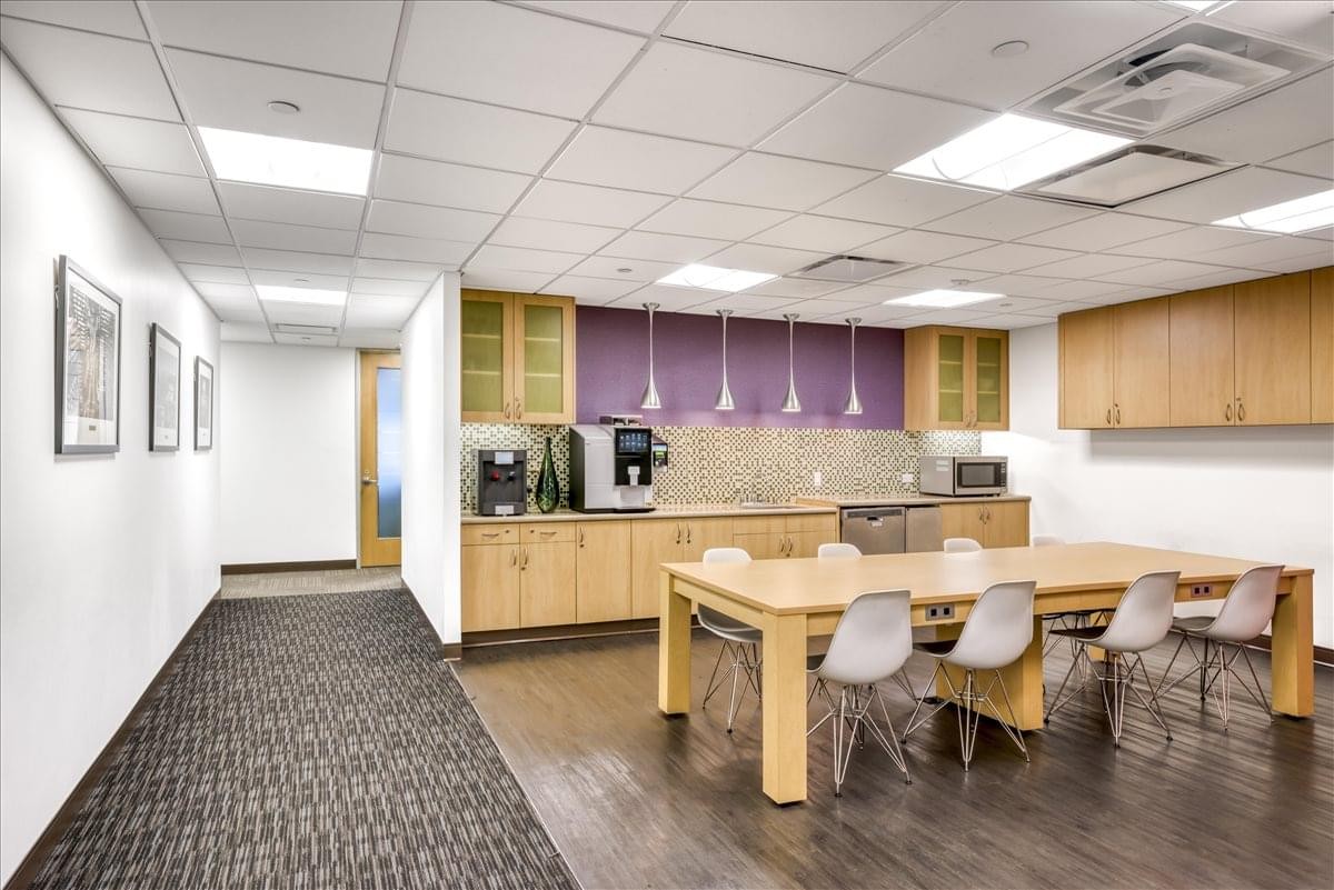 Modern communal kitchen and dining area at 100 Church Street, 8th Floor, Financial District, New York.