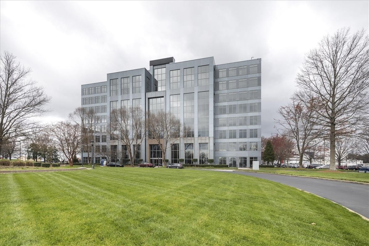 Exterior view of the modern glass facade of 100 Hartsfield Centre Parkway.