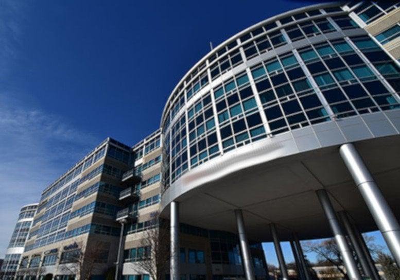 Exterior view of the curved glass facade at 100 TradeCenter.