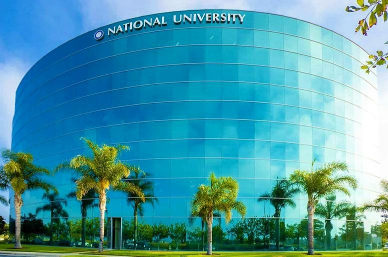 Exterior view of the curved glass facade of National University at 1000 Town Center Drive.