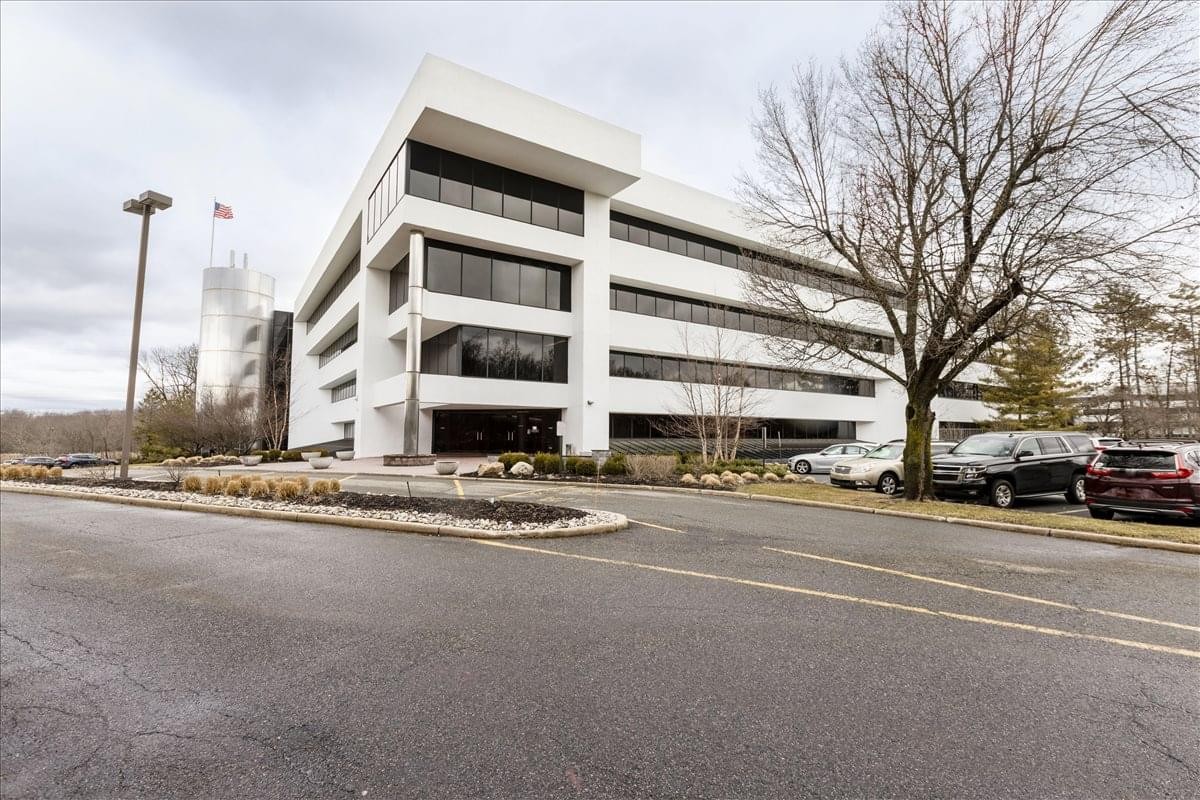 Exterior view of the white multi-story office building at 101 Eisenhower Parkway, Suite 300.