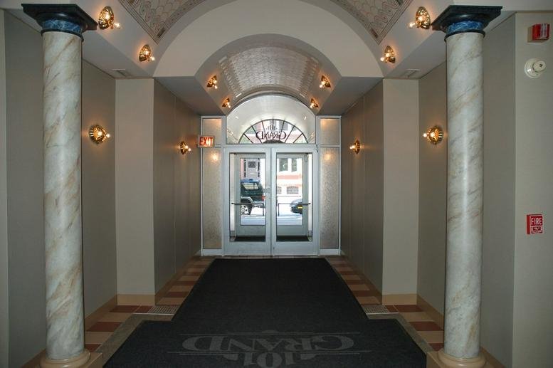 Classic vaulted lobby with marble columns at 101 West Grand Avenue.