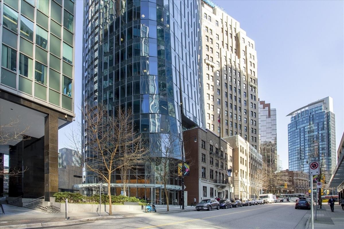 Exterior street view of the glass-facade tower and historic architecture of The Marine Building.
