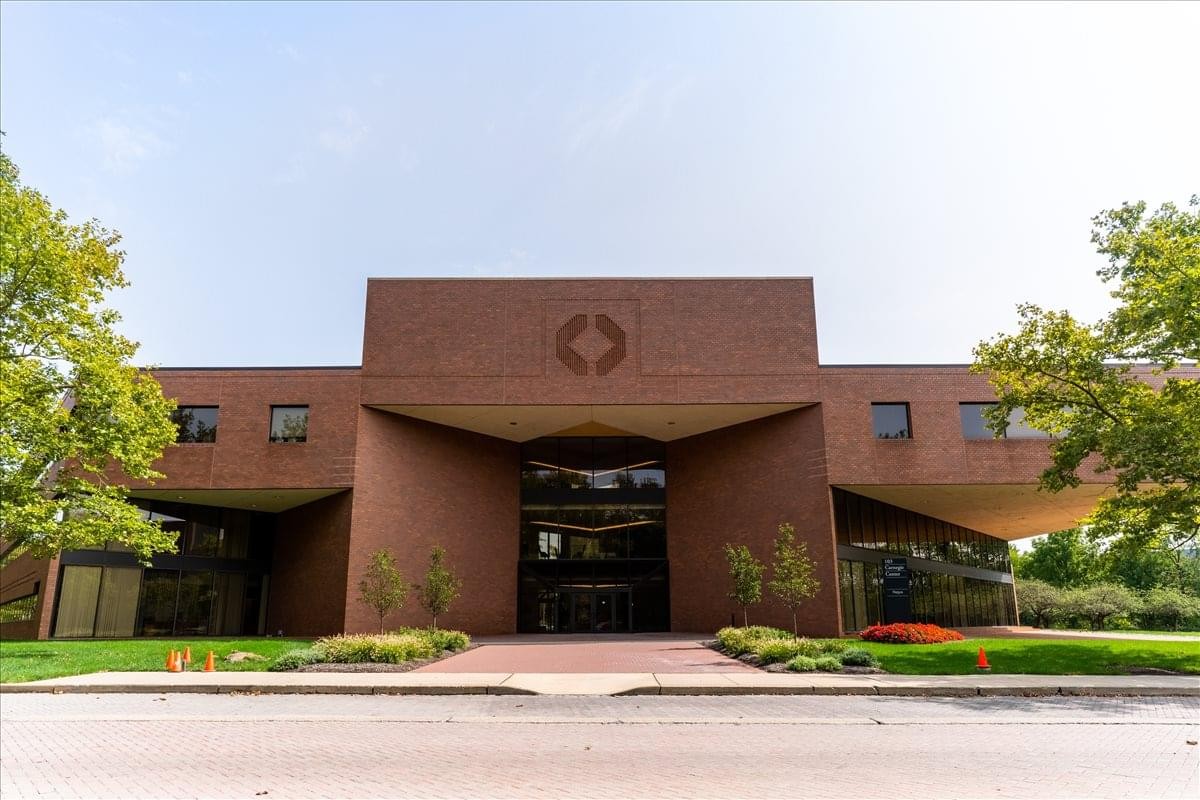 Exterior view of the brick facade and entrance at 103 Carnegie Center.