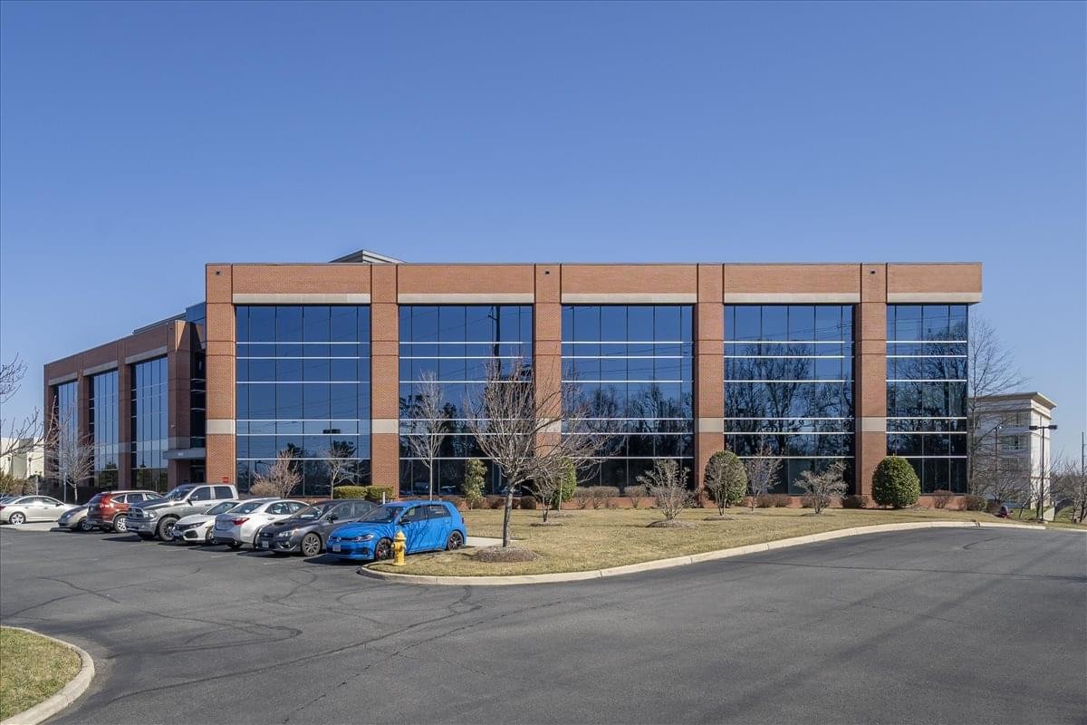 Exterior view of the brick and glass office building at 10432 Balls Ford Road.