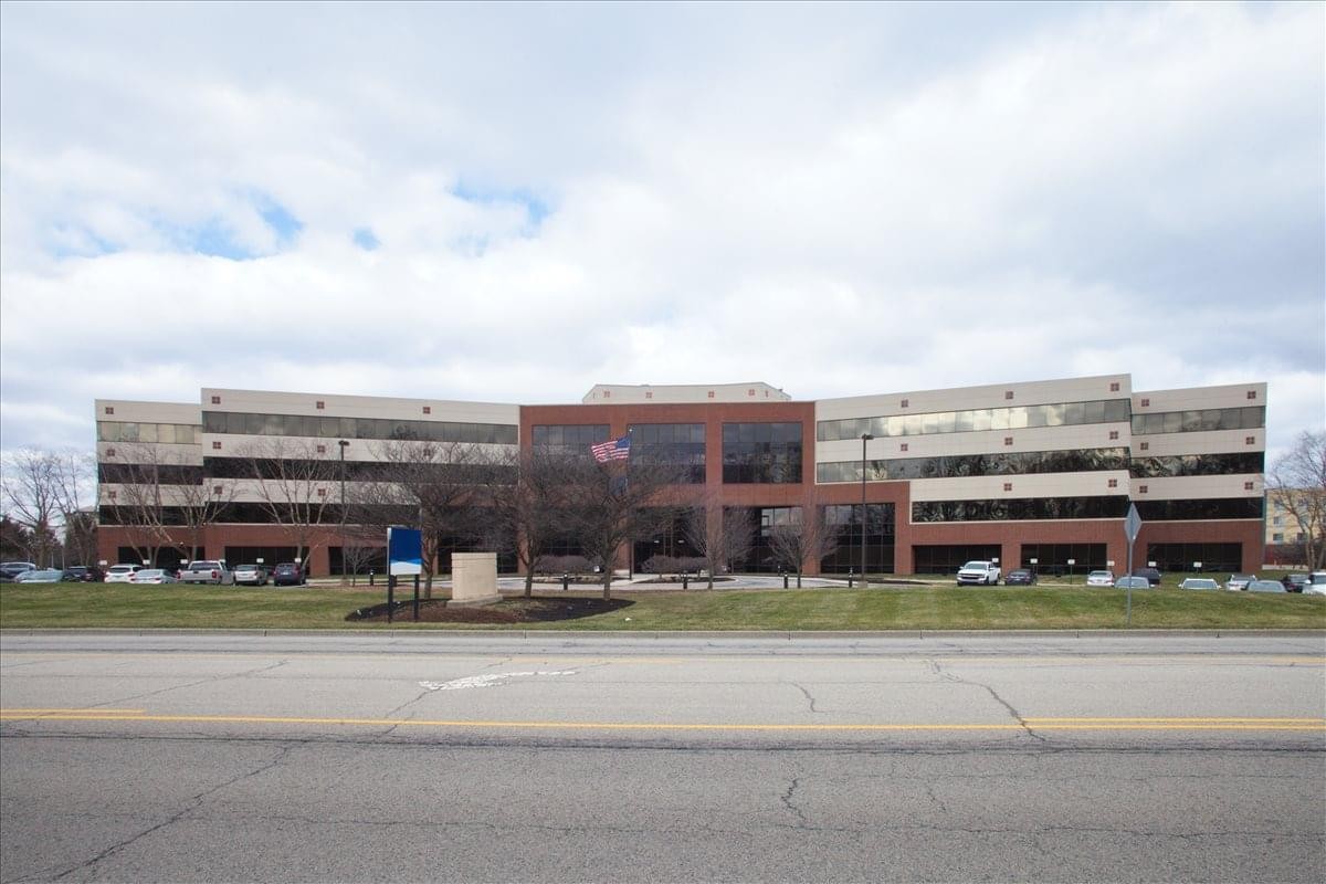 Exterior view of the brick and glass Fishers Centre building at 10475 Crosspoint Boulevard.