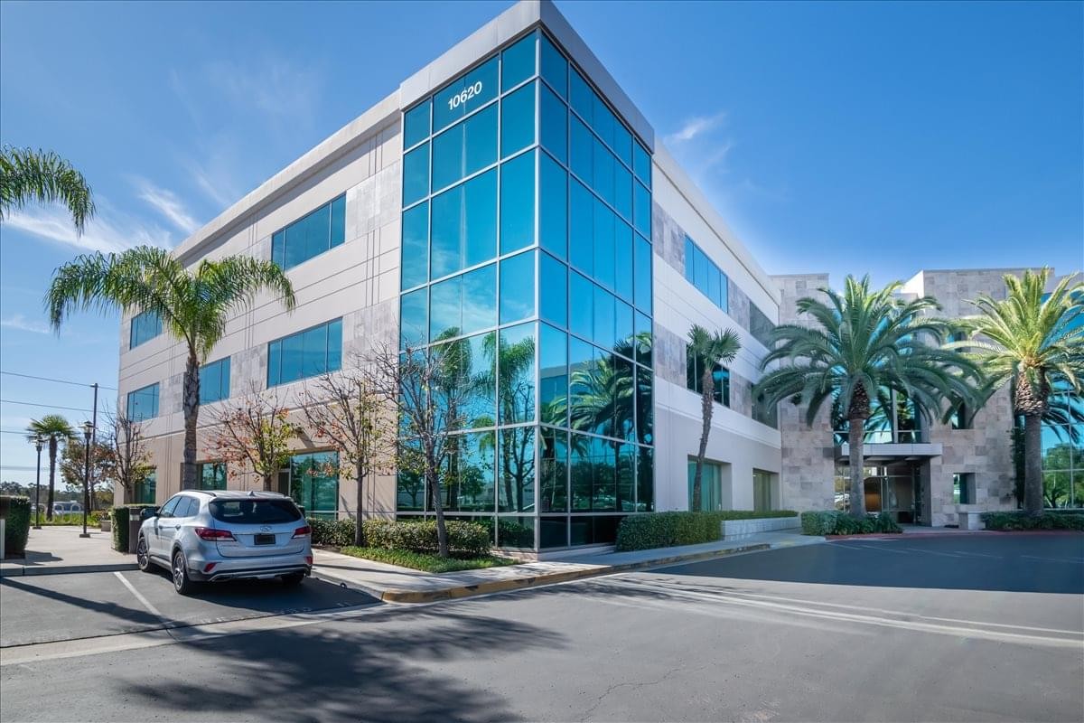 Modern exterior of the glass and stone office building at 10620 Treena Street.