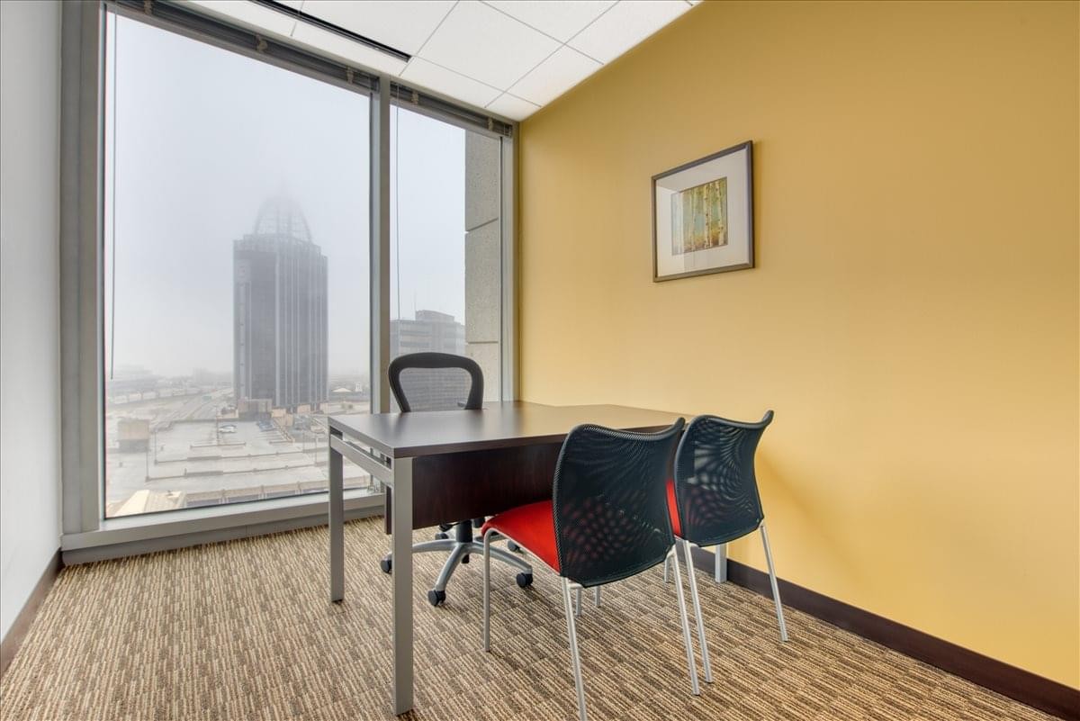 Sunlit private workspace at 11 N. Water Street, Suite 10290 with views of the RSA Battle House Tower.