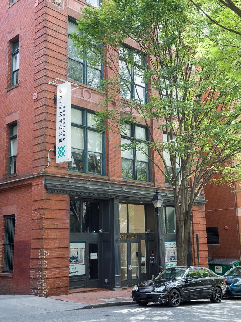 Exterior view of the historic red brick facade of 11 S 12th Street, Richmond, VA.