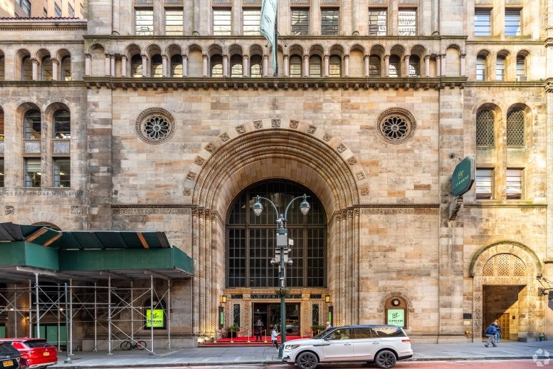 The ornate stone facade and arched entrance of Industrious Grand Central, 110 East 42nd Street.