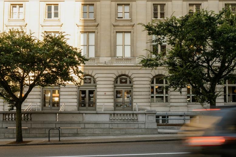 Exterior view of the historic stone facade at The Pioneer Collective, Courthouse Square, Tacoma.