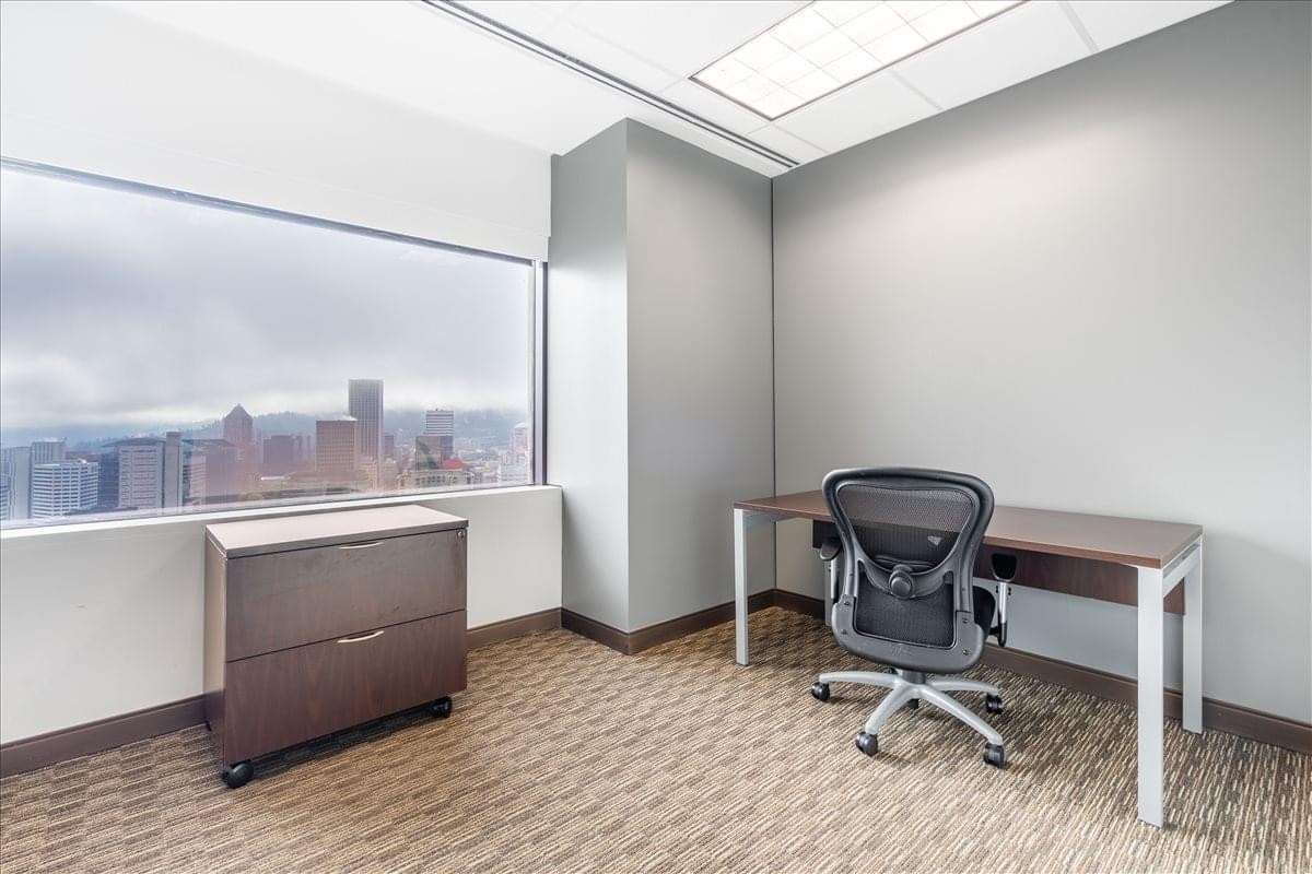 Private office featuring a desk and skyline views at 111 S. W. Fifth Avenue.