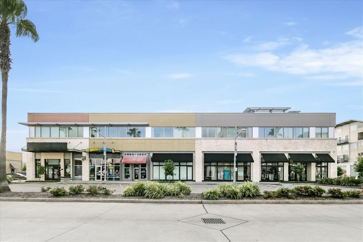 Exterior view of the contemporary retail and office building at 11200 Broadway, Suite 2743.