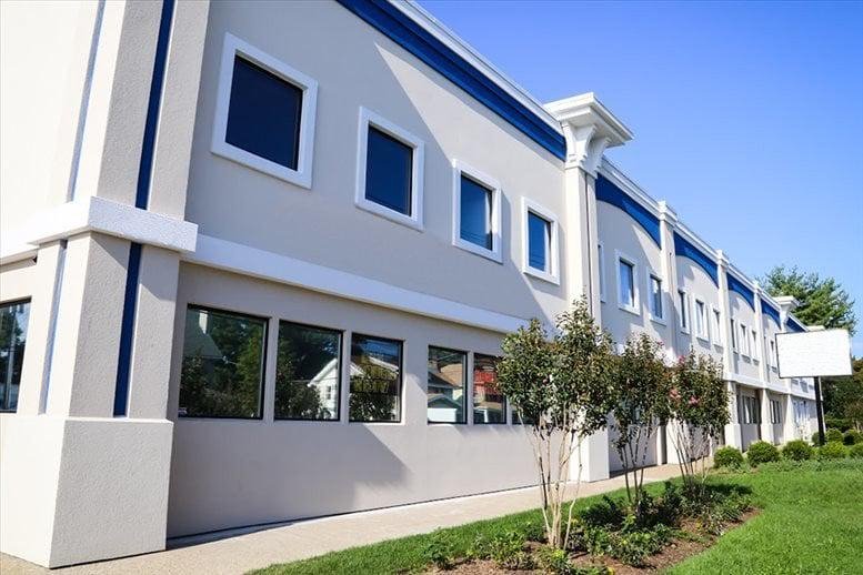 Exterior view of the white and blue facade of the building at 1125 West Street, Suite 200.