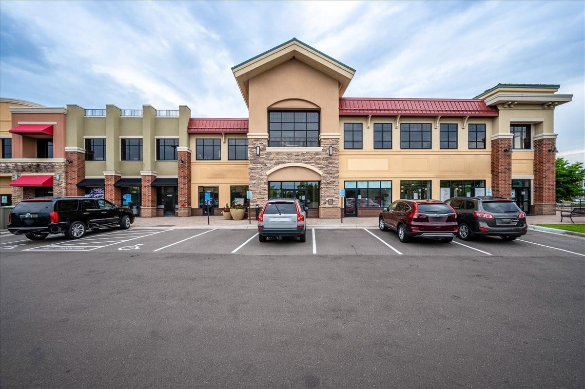 Exterior view of the multi-story retail and office building at 11670 Fountains Drive.
