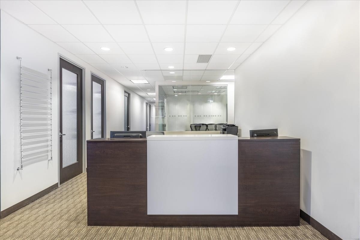 Modern reception desk at 118-35 Queens Blvd. , Suite 400, Forest Hills, New York.
