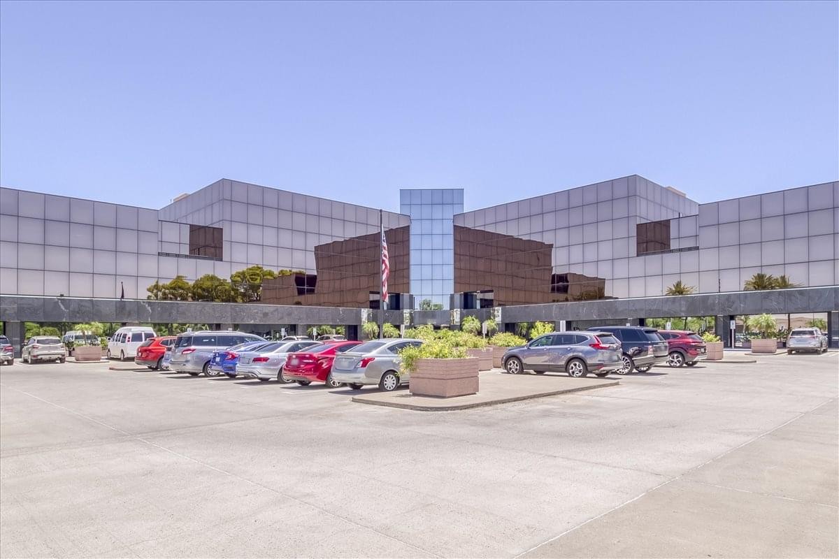 Exterior view of the Paradise Valley Center building facade with parking area.