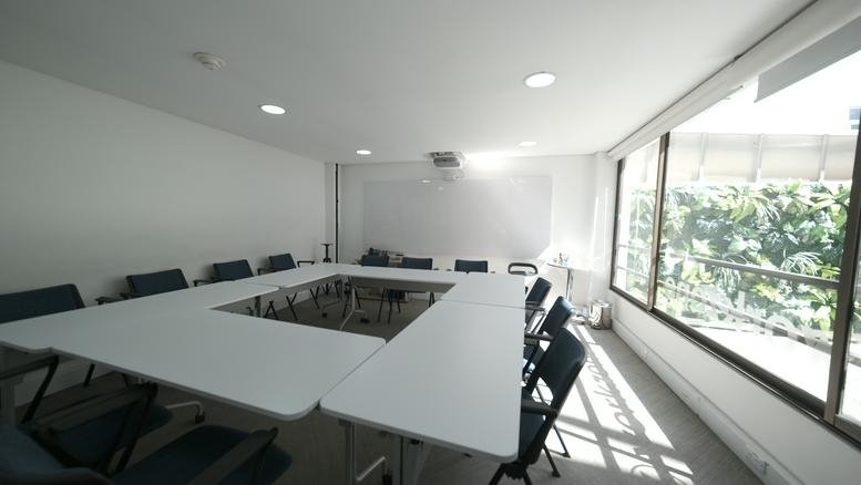 Meeting room at Workzone, Calle 99 #11b-66, Chicó Norte with large windows and a hollow square table layout.