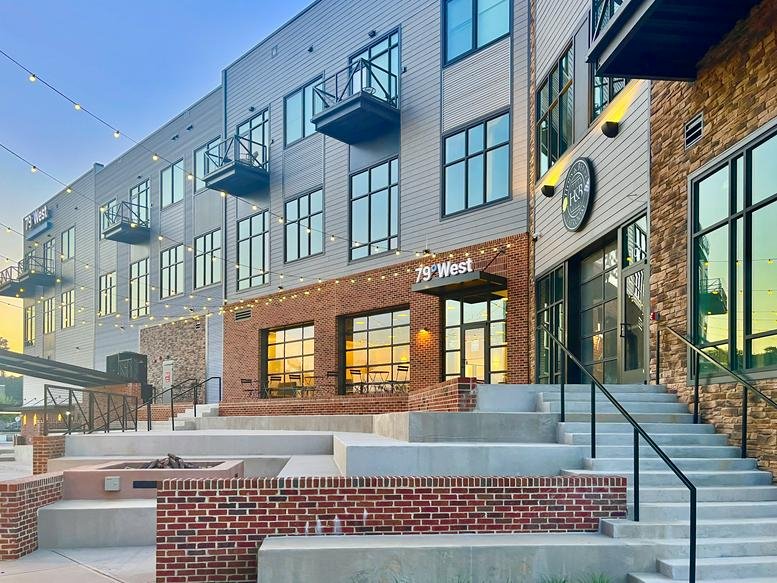 Exterior view of the modern brick and glass facade at 79°West Innovation Hub.