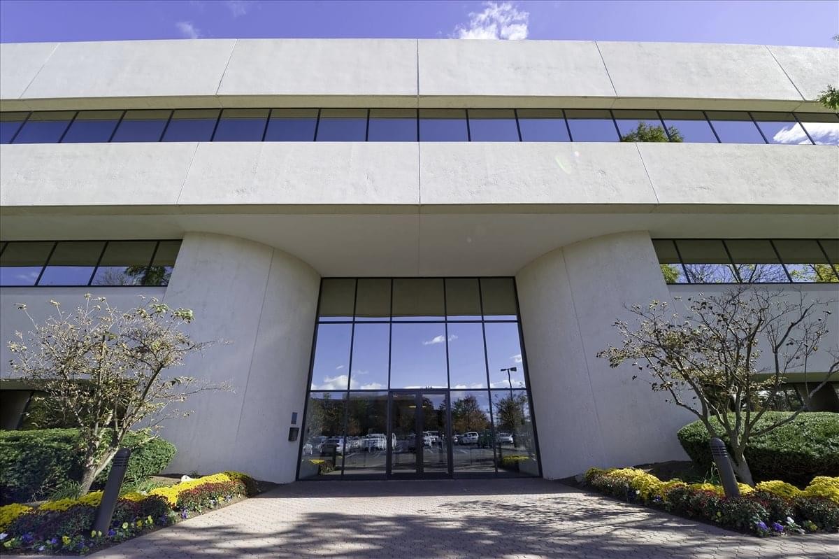 Symmetrical low-angle view of the modern concrete facade at Bridgewater Center.