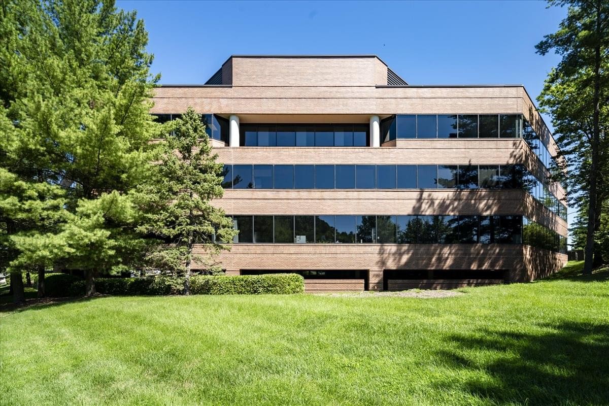 Exterior view of the multi-story 12020 Sunrise Valley Drive, Suite 100, Sunrise Valley Center building.