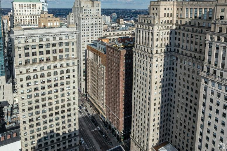Elevated view of surrounding historic skyscrapers and city streets.
