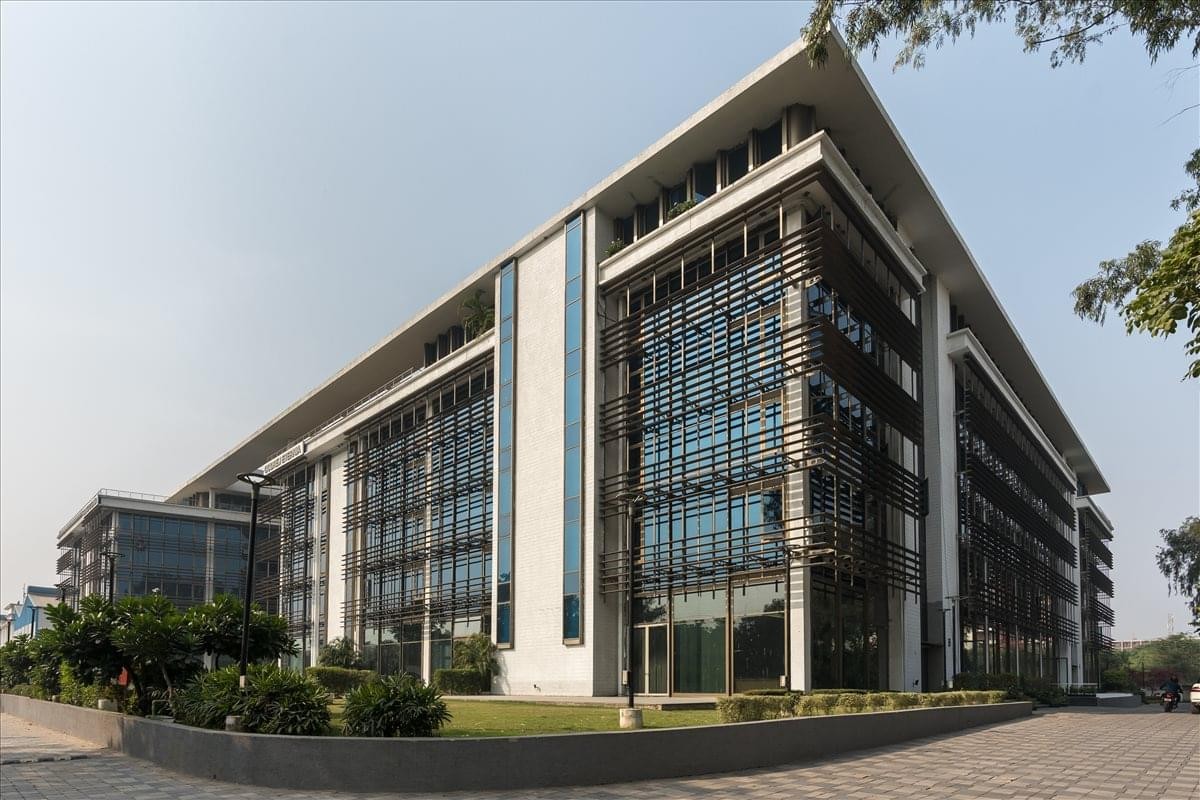 Exterior view of the modern glass and stone building at 1220 Main Street.