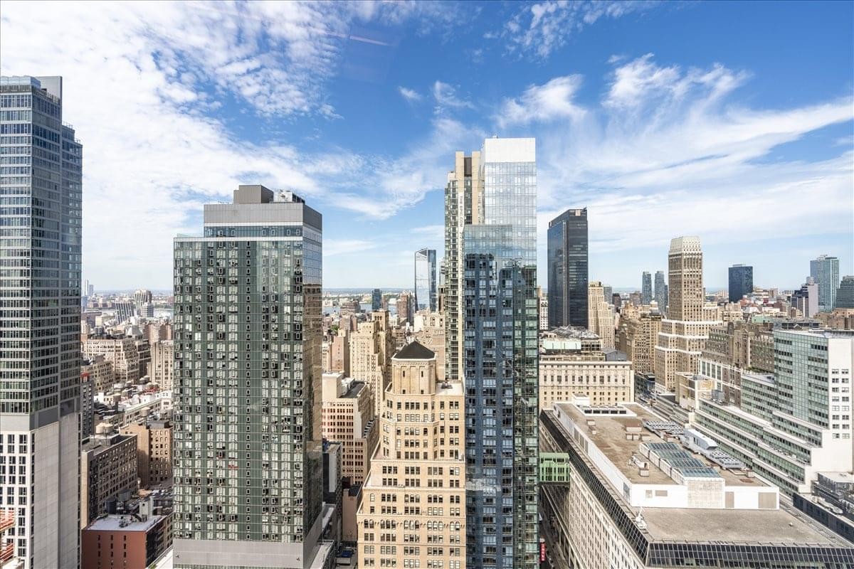 High-angle exterior view of the surrounding Midtown Manhattan skyline from 1250 Broadway.