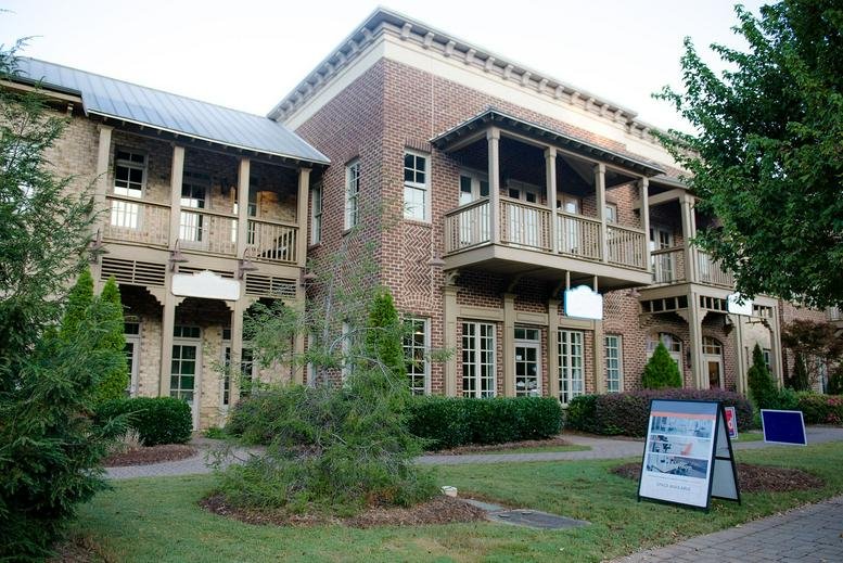 Exterior view of the brick facade building at 12540 Broadwell Road, Suite 2201, Alpharetta, Georgia.