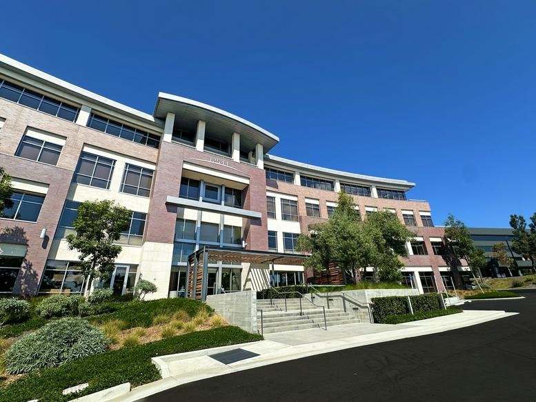 Exterior view of the modern, multi-story office building at One Del Mar.