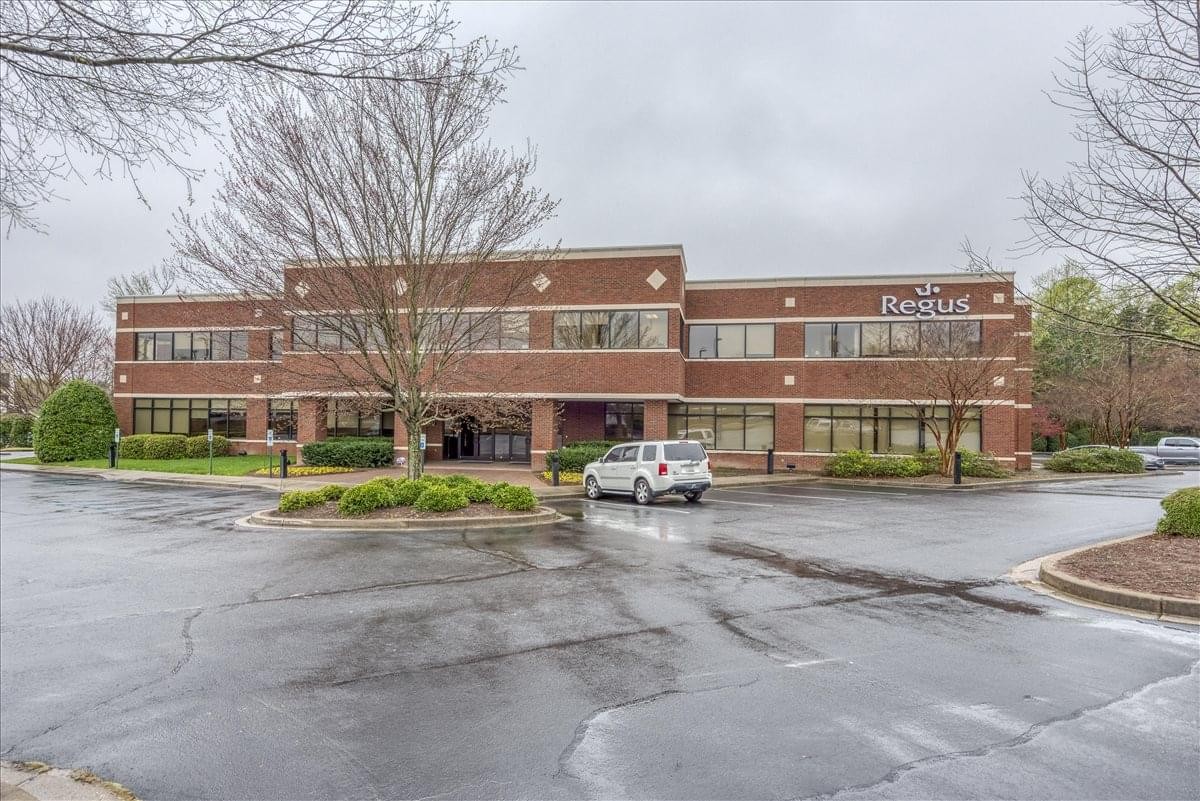 Exterior view of the brick facade building at 128 Millport Circle, Suite 200.