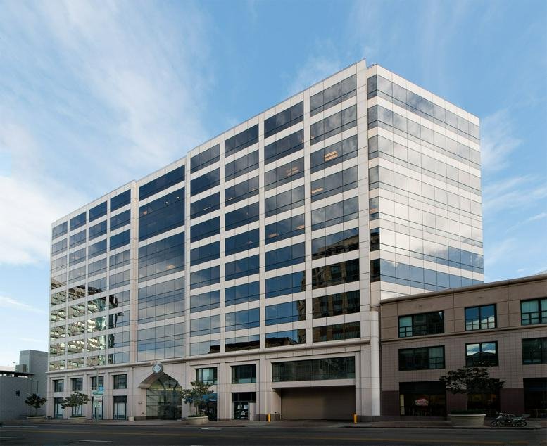 Exterior view of the glass-facade building at 1300 Clay Street, Suite 600.