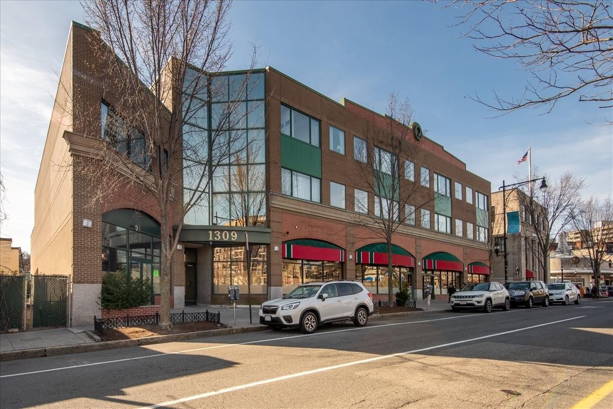 Exterior view of the brick and glass building at 1309 Beacon Street, Suite 300.