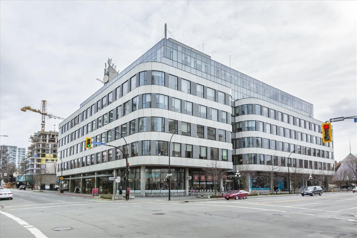 Exterior view of the white curved building at 1321 Blanshard St/800 Yates St.