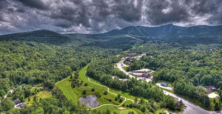Aerial view of Slope Space, Building 3, Level C, nestled in the green Vermont mountains.