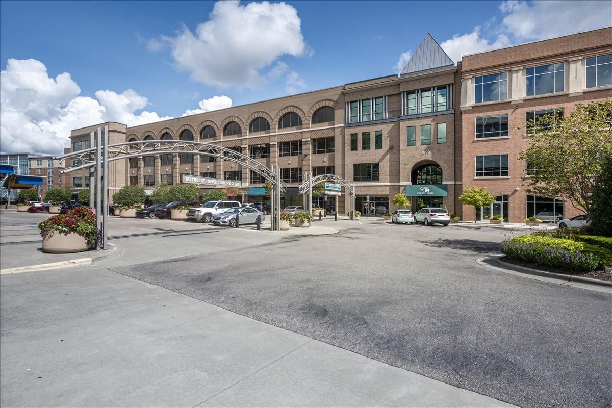Exterior view of the multi-story brick and glass building at 1340 Environ Way.
