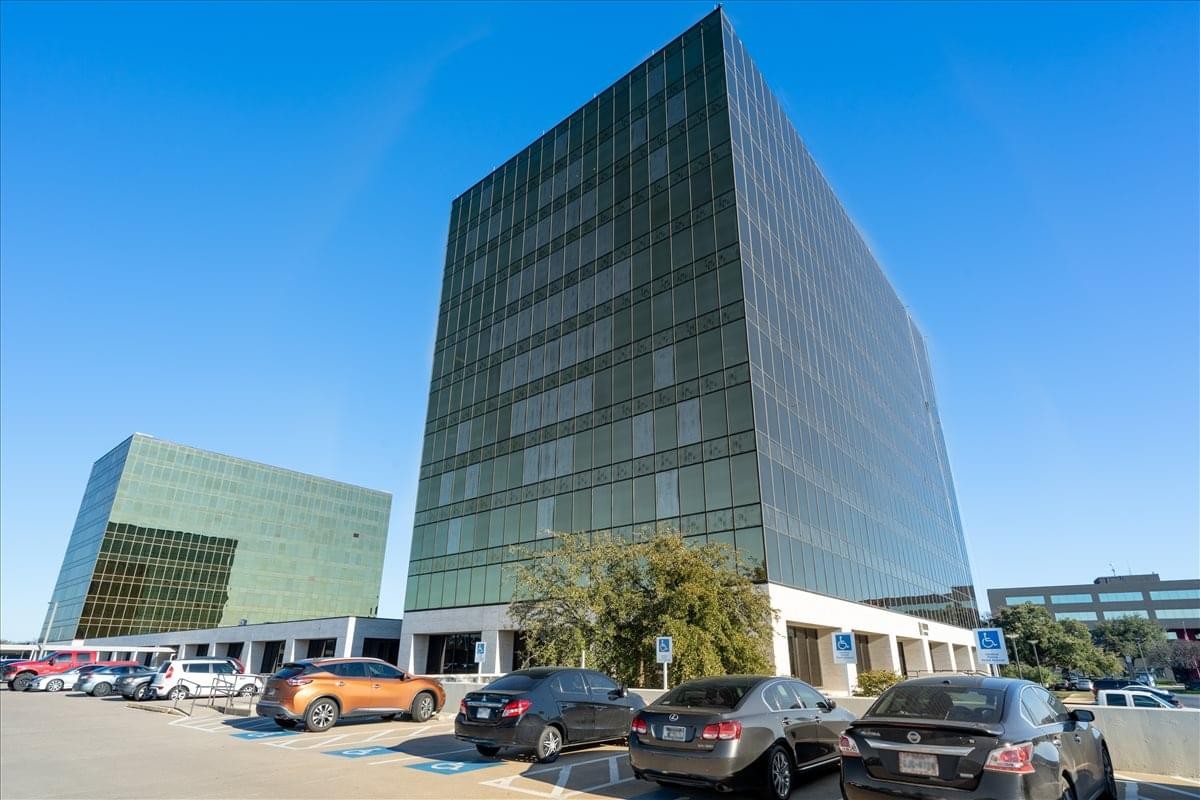 Exterior view of the glass-facade towers at Mockingbird Towers Business Center.