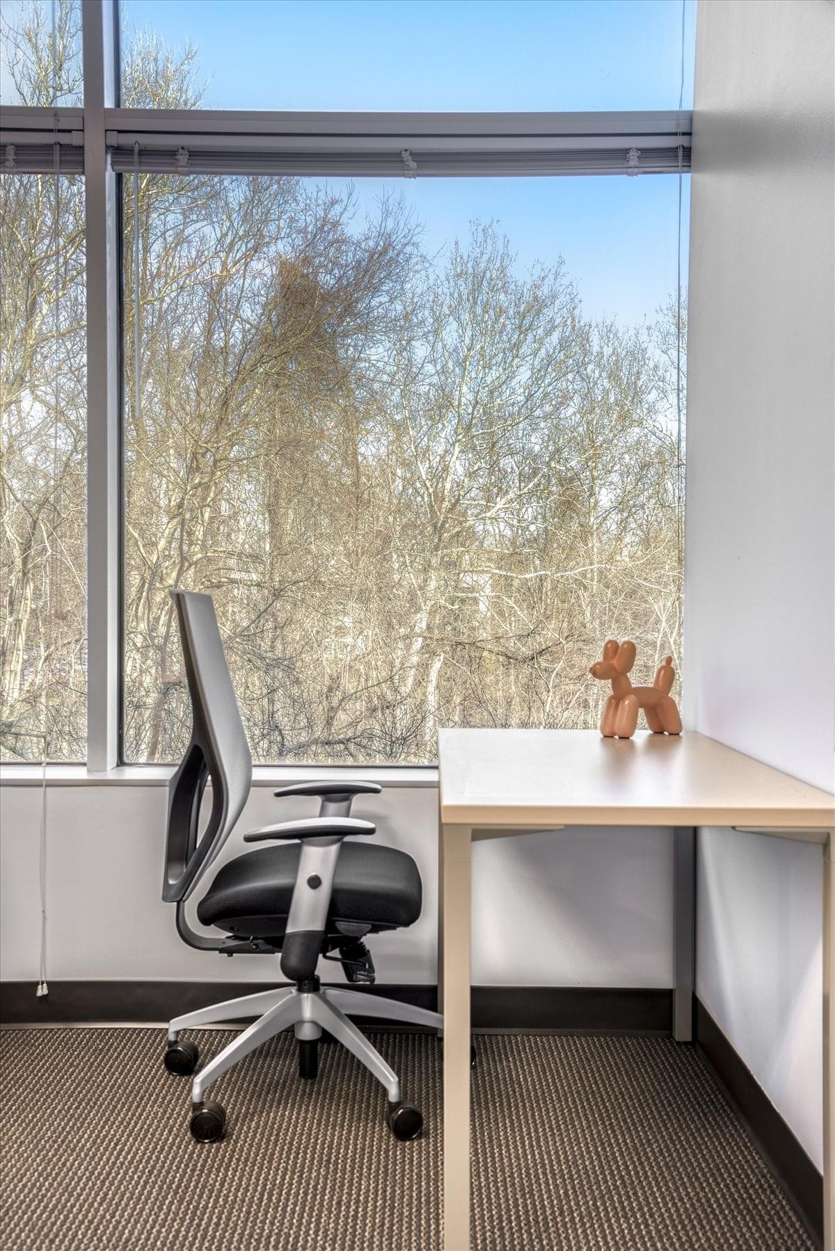 Exterior view of the multi-story glass and concrete building at 13800 Coppermine Road.