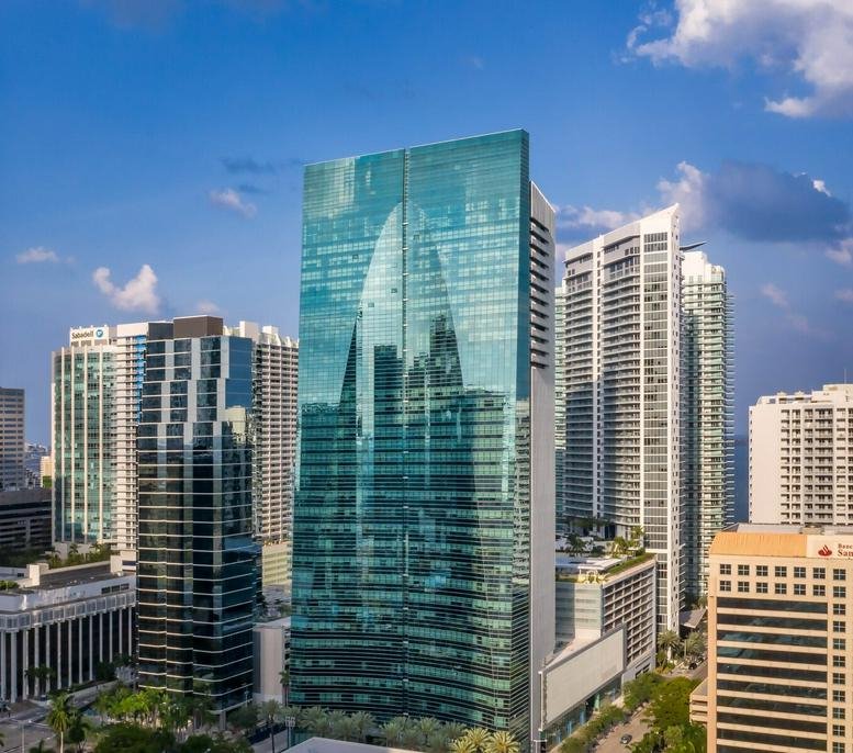 Exterior view of the green glass skyscraper at 1395 Brickell Avenue.