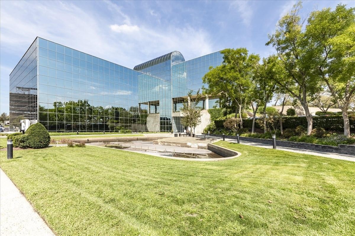Exterior view of the glass-facade building at 140 E Ridgewood Avenue.