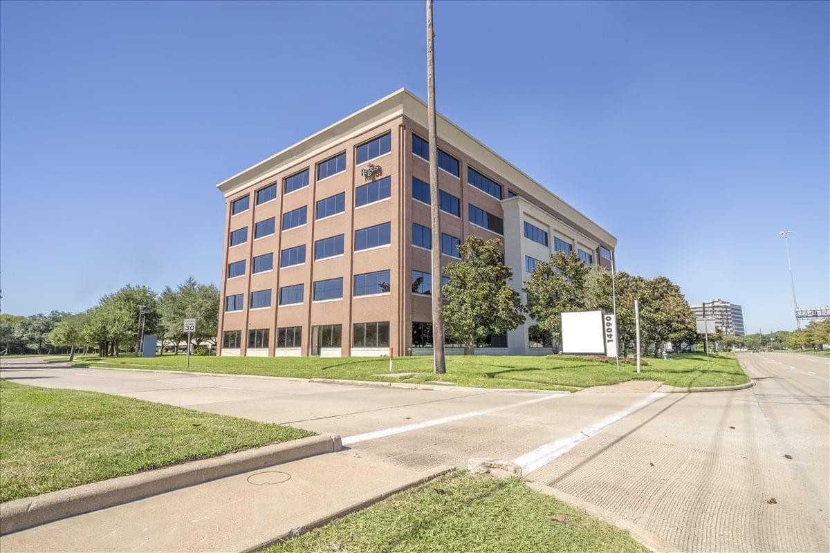 Exterior view of the brick and glass office building at 14090 Southwest Freeway, Suite 300.