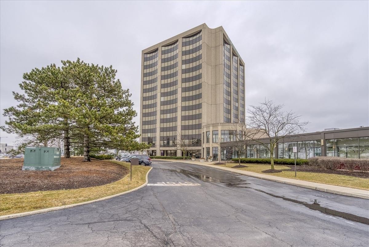 Exterior view of the multi-story Regency Towers Centre building featuring large glass windows.